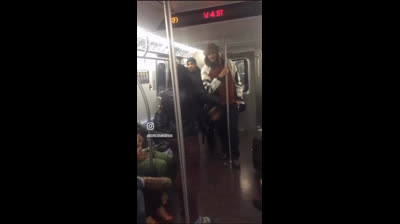 Man Smacks The Soul Out Of Girl That Was Clowning Him On The NY Subway